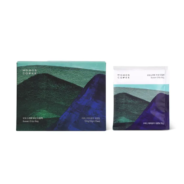 山の絵が描かれた緑と紺のドリップバッグの箱と、1個分の袋